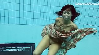 Russian teen diving while showing off her natural tits