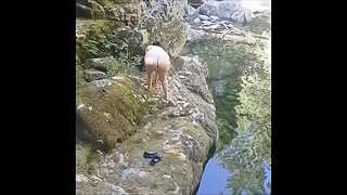 MILF flashing and masturbating by the river