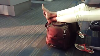 Moroccan candid feet at airport (high arches)