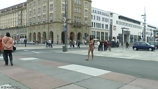 Long haired brunette walks naked in public in hd movie