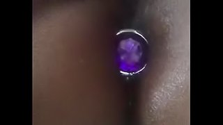 Ebony BBW removing large butt plug from arse. Damn.